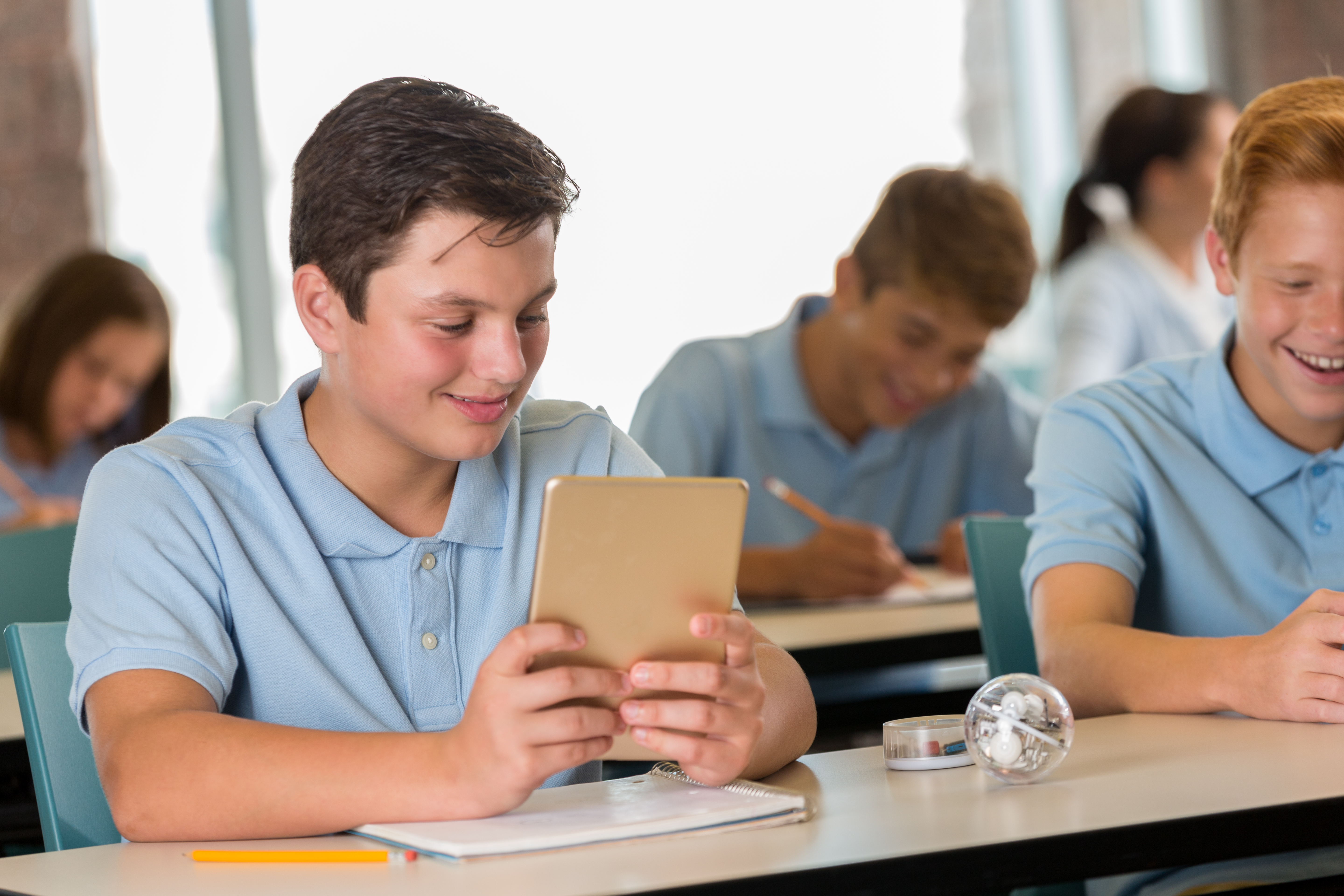 Students using assistive technology in a classroom